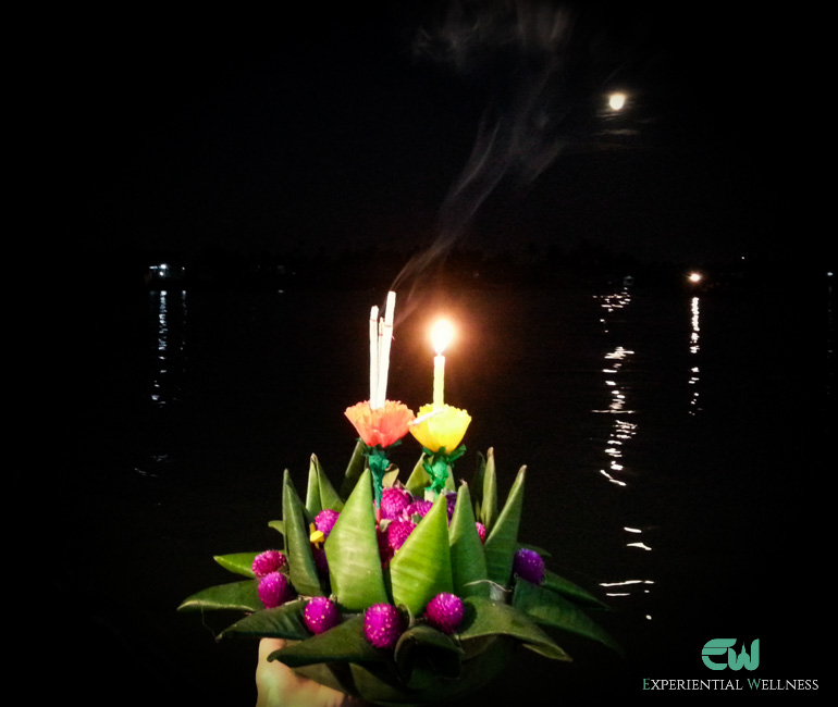 Thai people float Krathong on to the Chao Phraya River