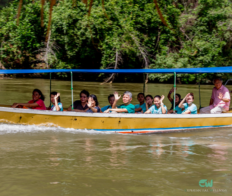 Thai tourists are enjoying and smiling during their river tour