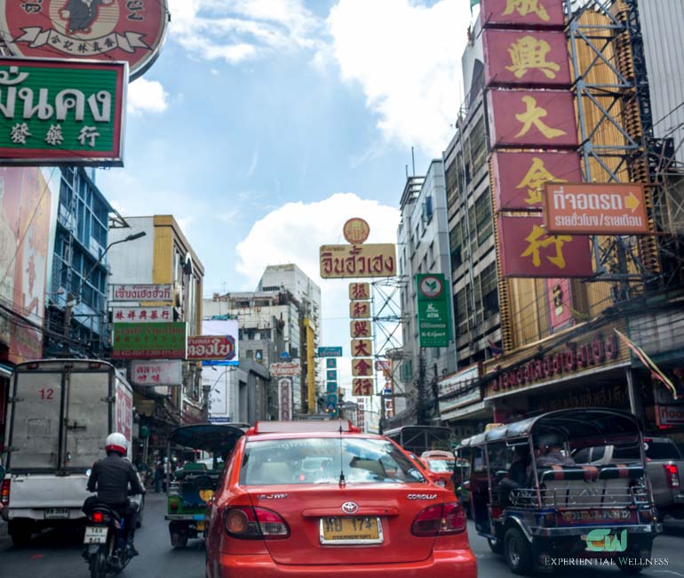 Taxi and tuktuk were heading through the Chinatown in Bangkok