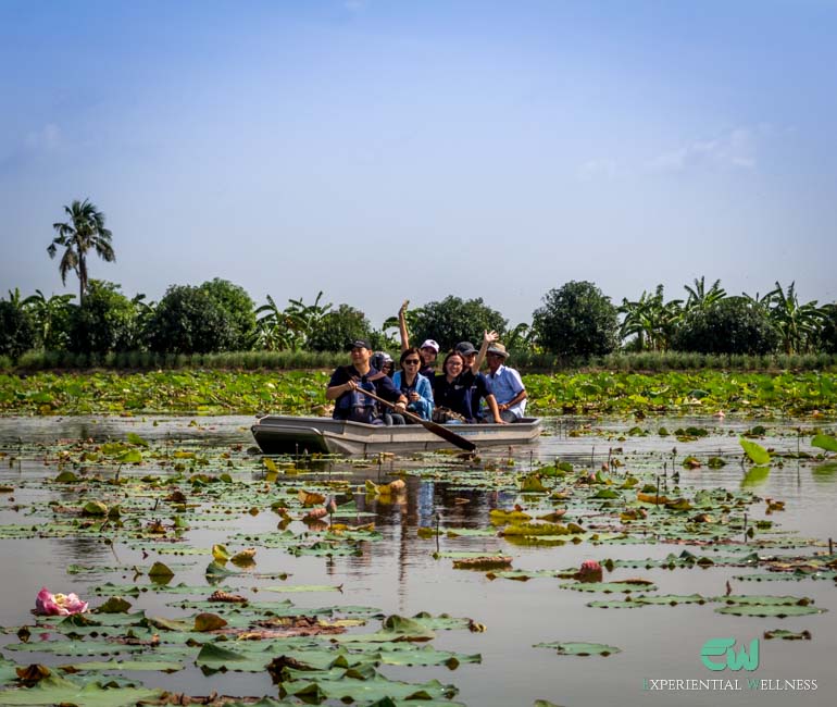 Tourists enjoy paddling on a paddle boat at Khlong Mahasawat