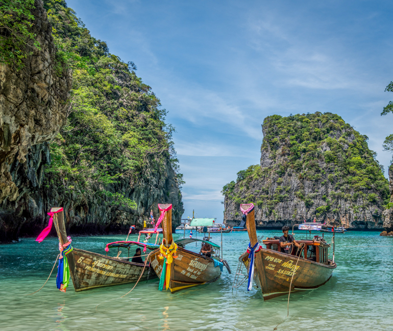 Long-tail tourist boat and limestone islands