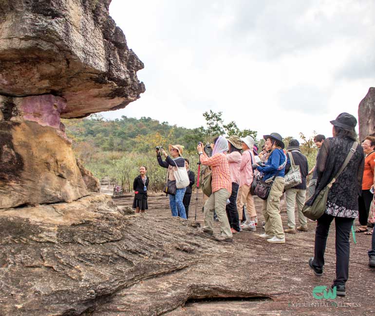 A group of tourists travel to Phu Phra Bat Historical Park