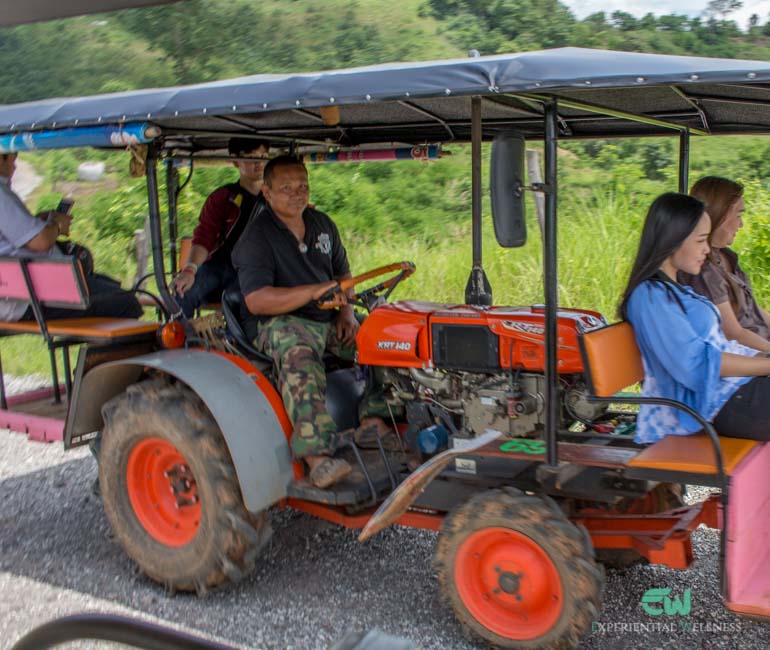 A local farm vehicle contains a group of tourists