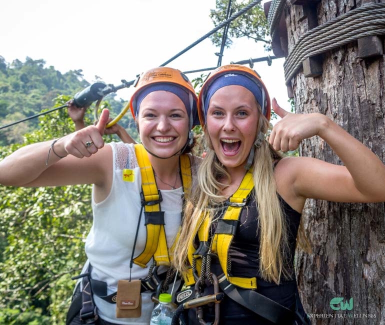 girls give thumb ups for their great and memorable zipline experience