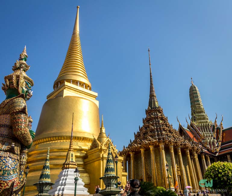 A giant, the Golden Stupa, and the royal Prasat spire in Wat Phra Kaew, the Grand Palace