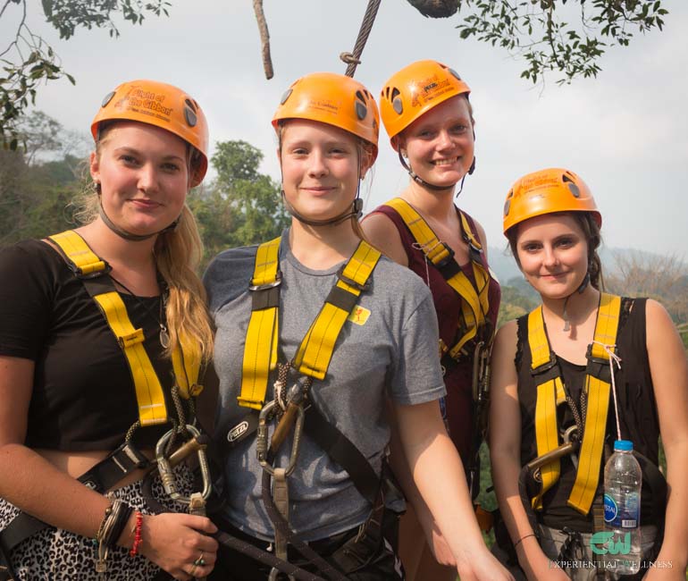 Tourist girls enjoy zipline activity at Flight of the Gibbon