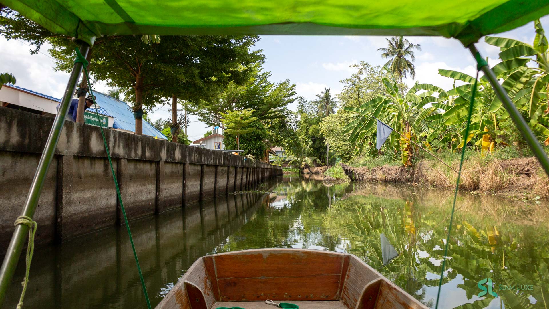 A long-tail speedboat through the Mahasawat Canal Tour in Thailand