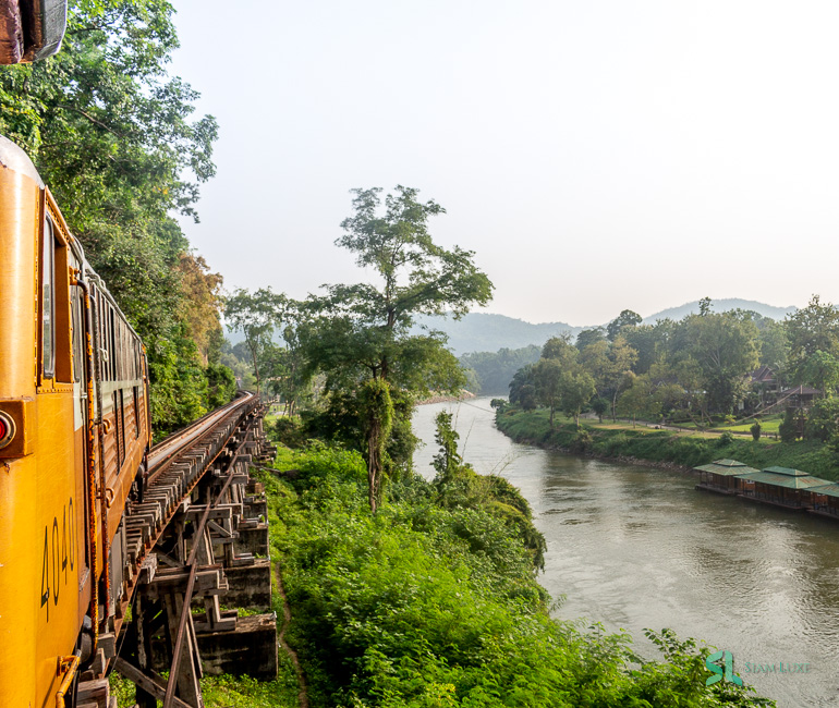 The old nostalgic train along the River Kwai in Kanchanaburi