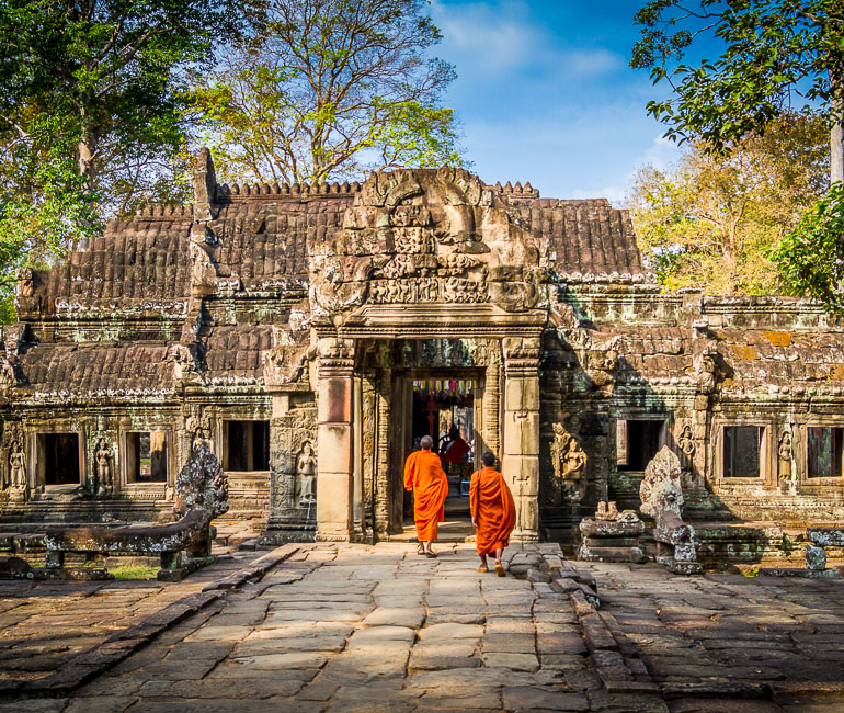 Buddhist monks on the entrance of Ta Prohm temple