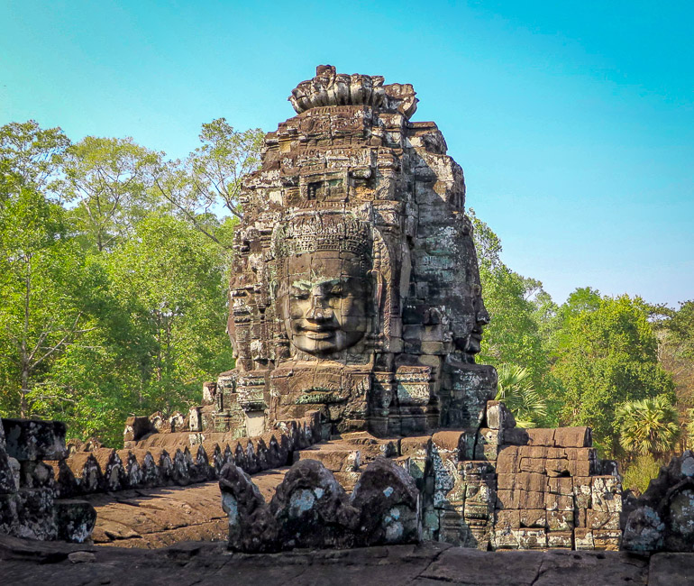 Buddha face in the Bayon style of arts in Angkor Wat and Angkor Thom